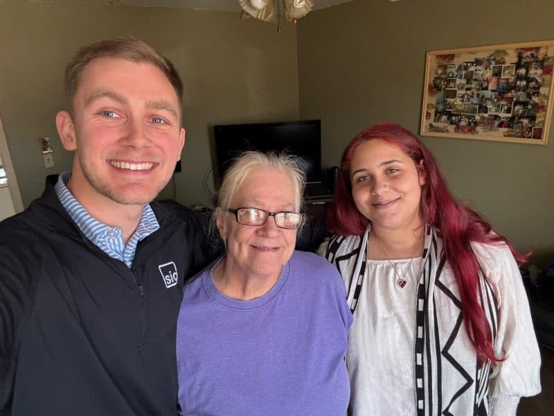 Sahlman Insurance Group team member with clients (2)